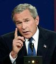 Bush
                            mit erhobenem Zeigefinger. Er ist immer für
                            einen "Irakkrieg", obwohl gar
                            keine Flugzeuge in den Türmen steckten
