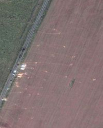 air
                          photo with footpaths into a wheatfield where
                          objects were put for simulating a crash of an
                          airplane