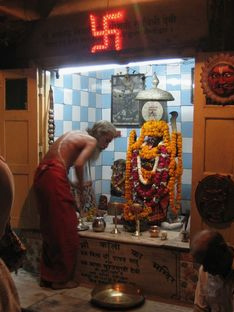 Hinduism: Shrine with the goddess Kali with swastika, certain circles in the Indian culture say this would be in the negative direction, town of Varanasi, India