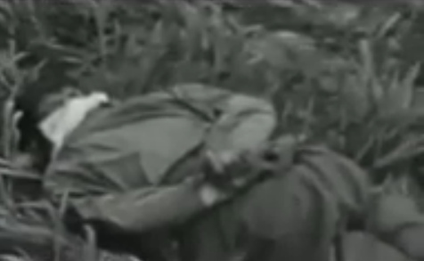 Torture position on the knees with the
                          hands bound on the back