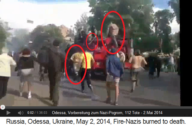 Rechter Block mit Feuerwehrauto 03 mit
                    ukrainischen Soldaten und mit einem Nazi-Schl�ger,
                    der mit dem Kn�ppel auf dem Dach den
                    "Takt" angibt