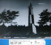 NS film: a V2 rocket is set up upright on
                          a carriage