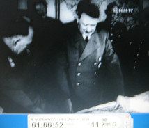 NS film
                        02: Hitler and Speer on a briefing at a table
                        with a plan